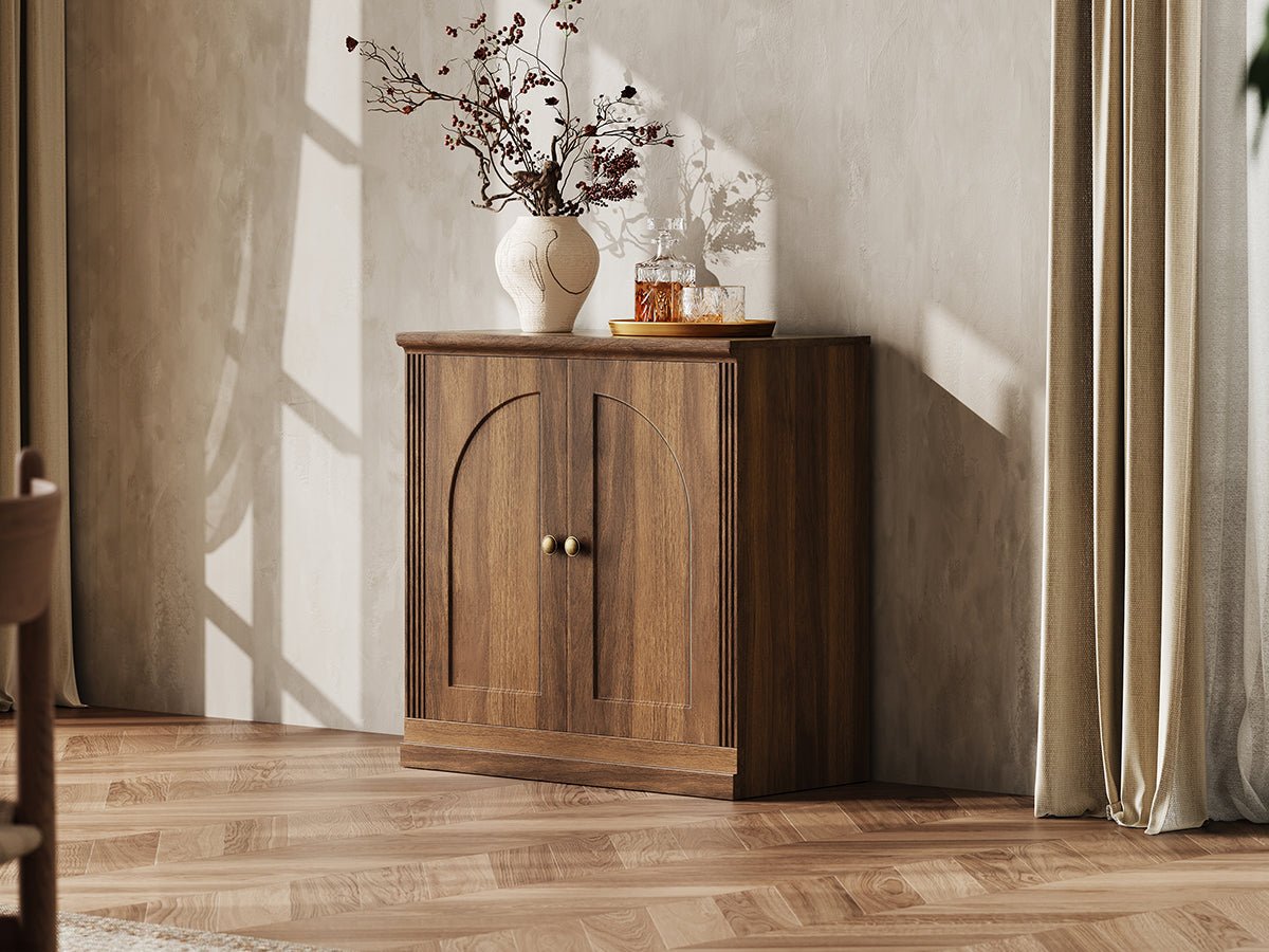 Monos walnut hinged storage cabinet styled in a lifestyle room scene with decor