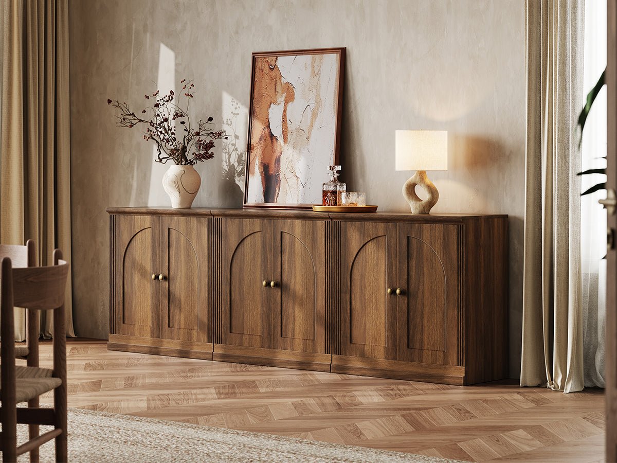 MONOS walnut modular sideboard cabinet set with three hinged storage cabinets styled under wall art in a warm living room