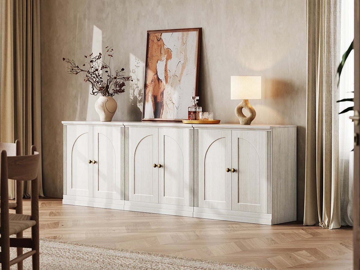 MONOS white oak modular sideboard cabinet set with three hinged storage cabinets styled under wall art in a bright living room