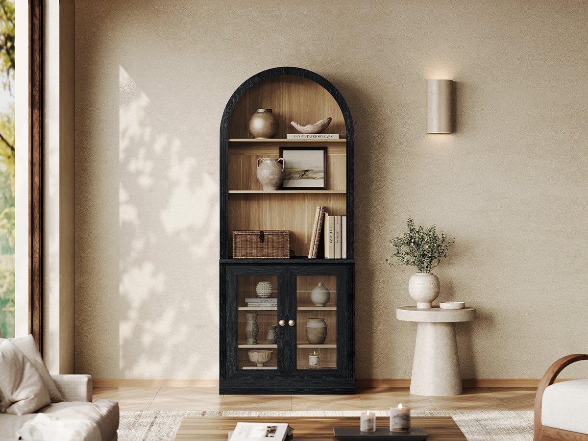 Monos black arch-top display cabinet with open shelves and glass doors in a living room