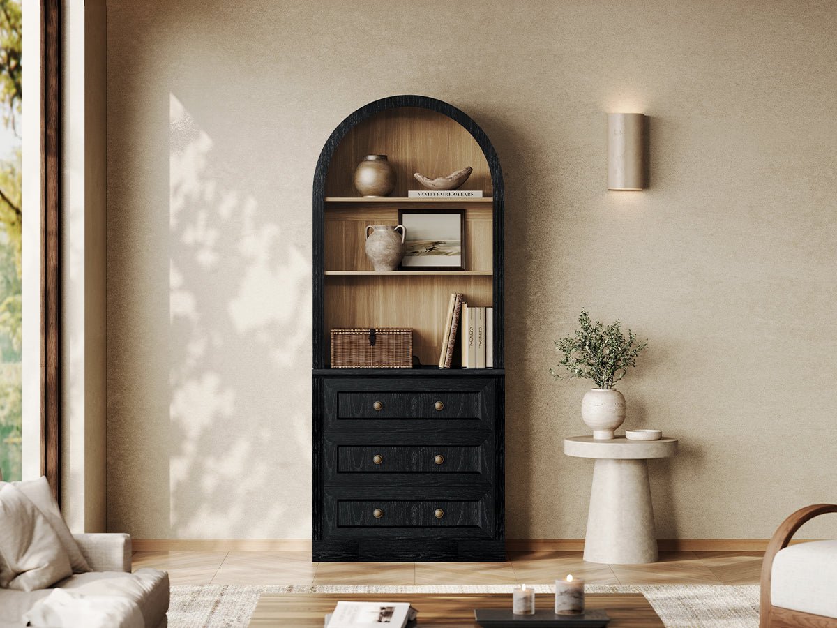 Monos black arch-top drawer cabinet with open shelves and lower drawers in a living room
