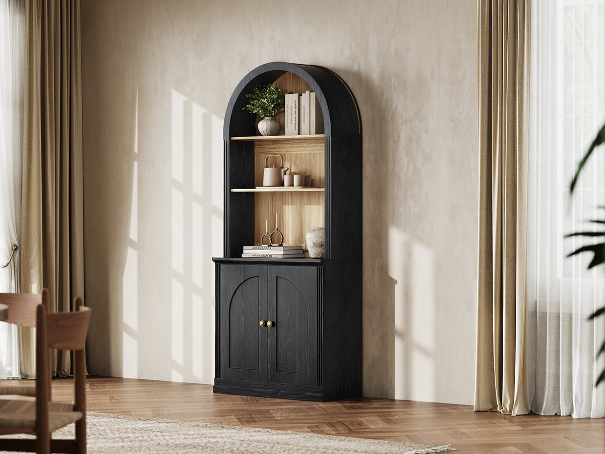 Monos black tall arch-top hinged cabinet styled in a bright lifestyle room scene