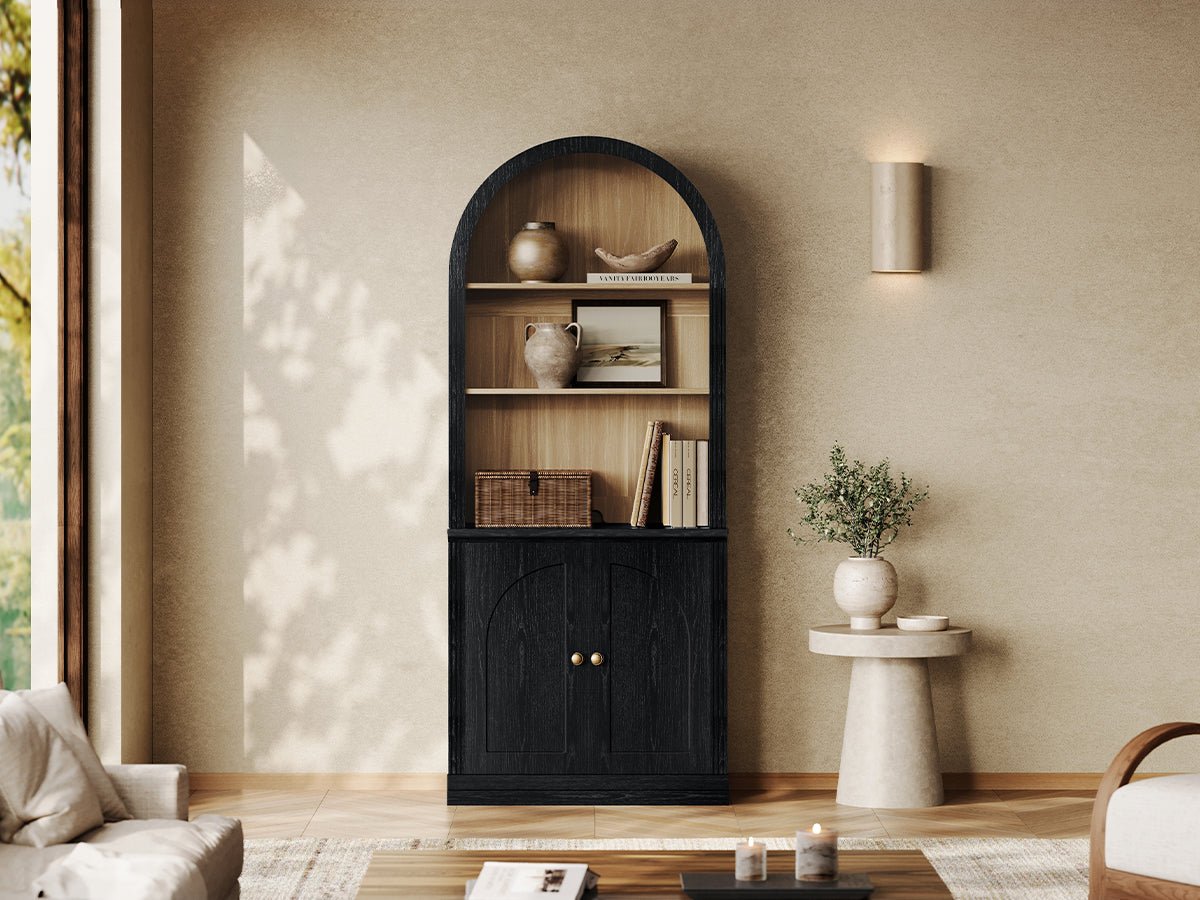 Monos black arch-top storage cabinet with open shelves and lower doors in a living room