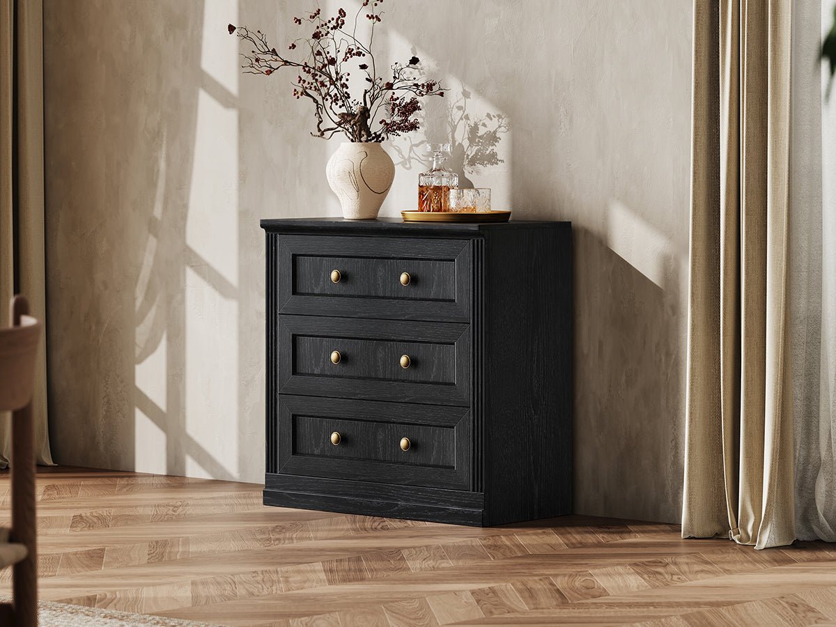 Monos black drawer storage cabinet styled in a lifestyle room scene with tabletop decor