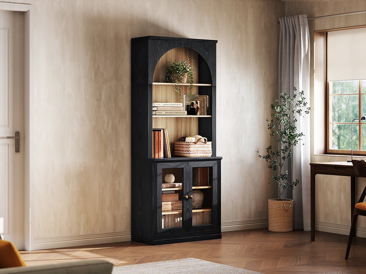 Monos black tall display cabinet shown beside a window with books and decor inside
