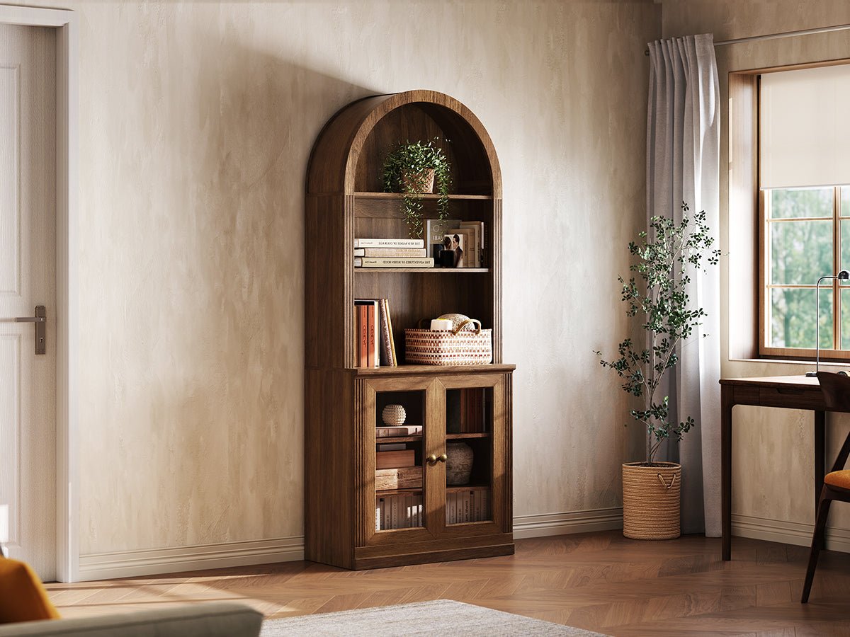 Monos walnut tall display cabinet shown beside a window with books and decor inside