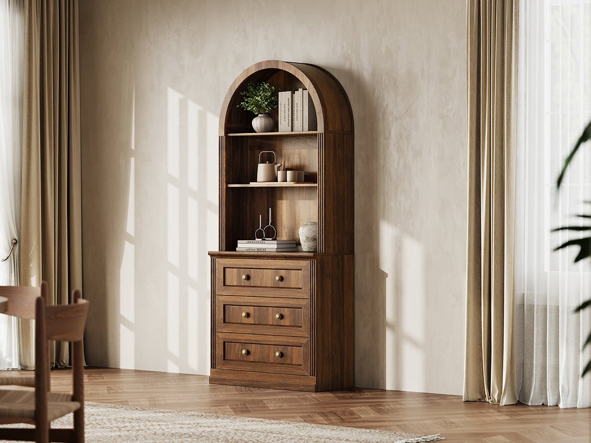Monos walnut tall arch-top drawer cabinet styled in a warm lifestyle room scene