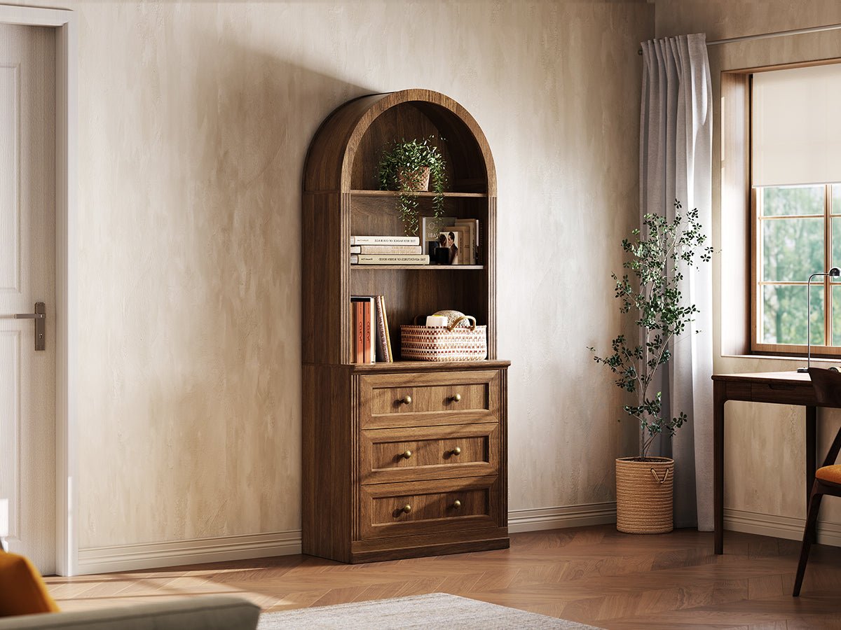 Monos walnut tall drawer cabinet shown beside a window with books and decor