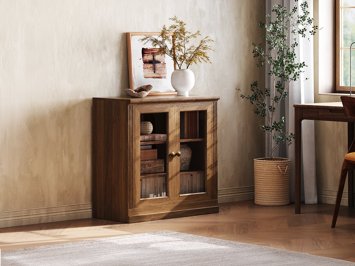 Monos walnut display storage cabinet shown beside a window with books and decor inside