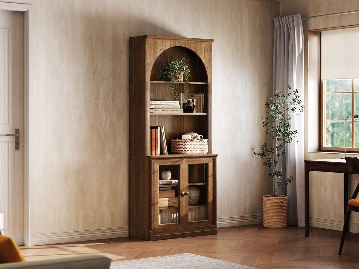 Monos walnut tall display cabinet shown beside a window with books and decor inside