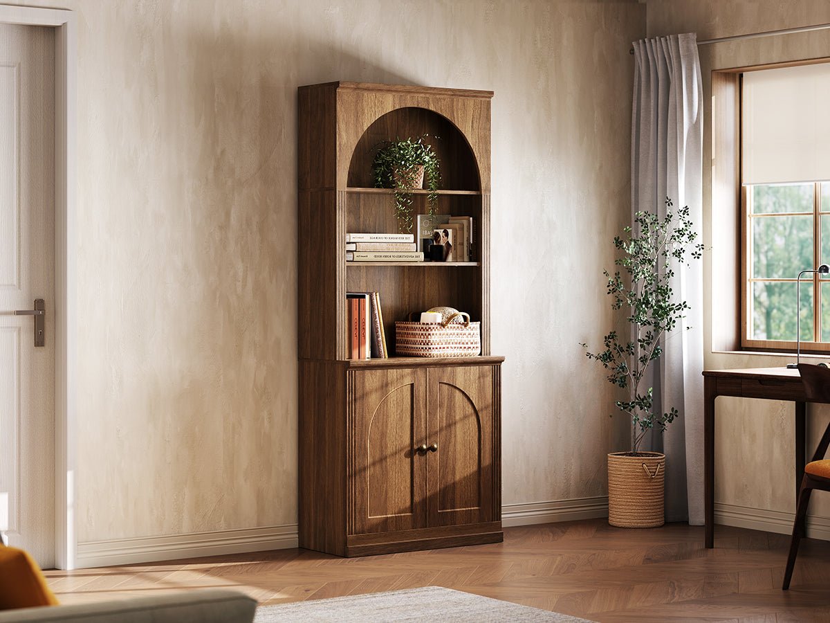 Monos walnut tall flat-top cabinet displayed beside a window with books and decor