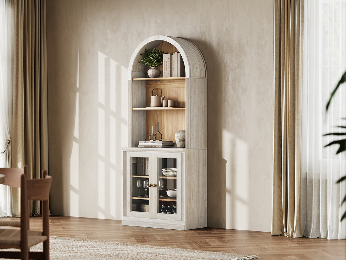 Monos white tall arch-top display cabinet styled in a bright lifestyle room scene