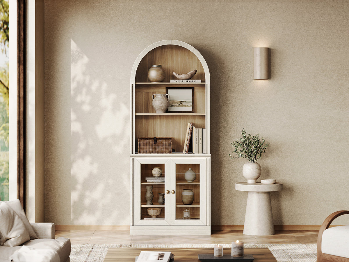 Monos white arch-top display cabinet with open shelves and glass doors in a living room