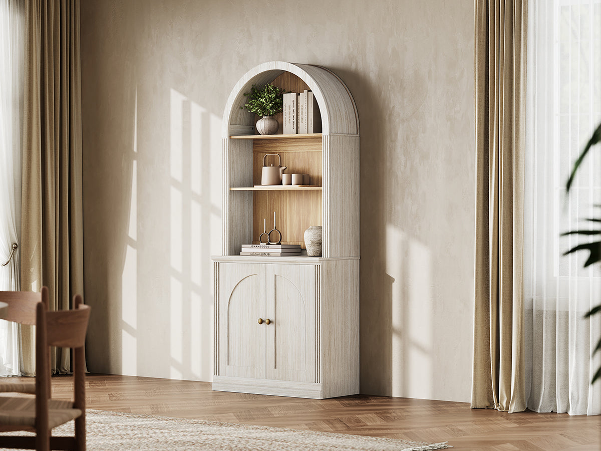 Monos white tall arch-top hinged cabinet styled in a bright lifestyle room scene