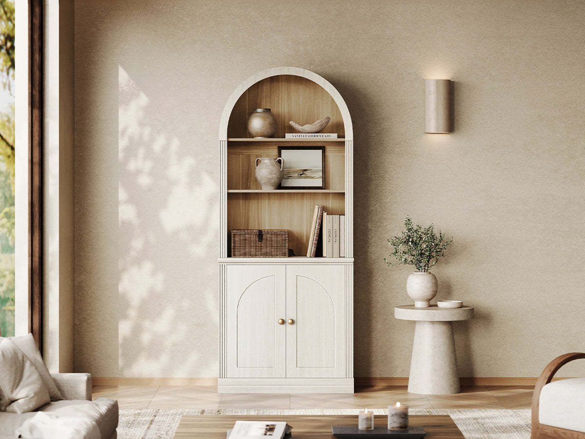 Monos white arch-top storage cabinet with open shelves and lower doors in a living room