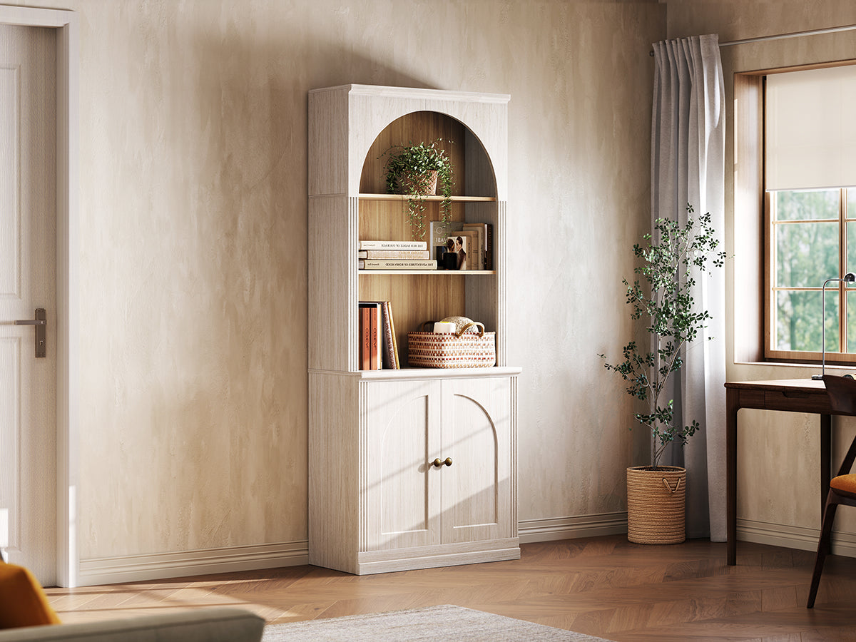 Monos white tall flat-top cabinet displayed beside a window with books and decor
