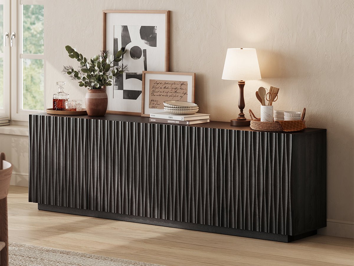 ORYVIA black wavy fluted storage cabinet with vertical wavy fluted doors styled with vases, wall art, and tabletop decor