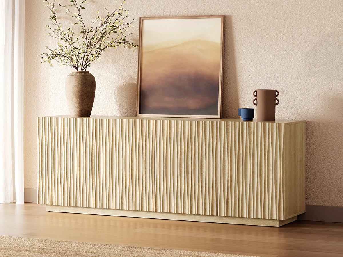 ORYVIA natural wavy fluted storage cabinet with sculpted wave doors styled as a modern sideboard with vases and artwork
